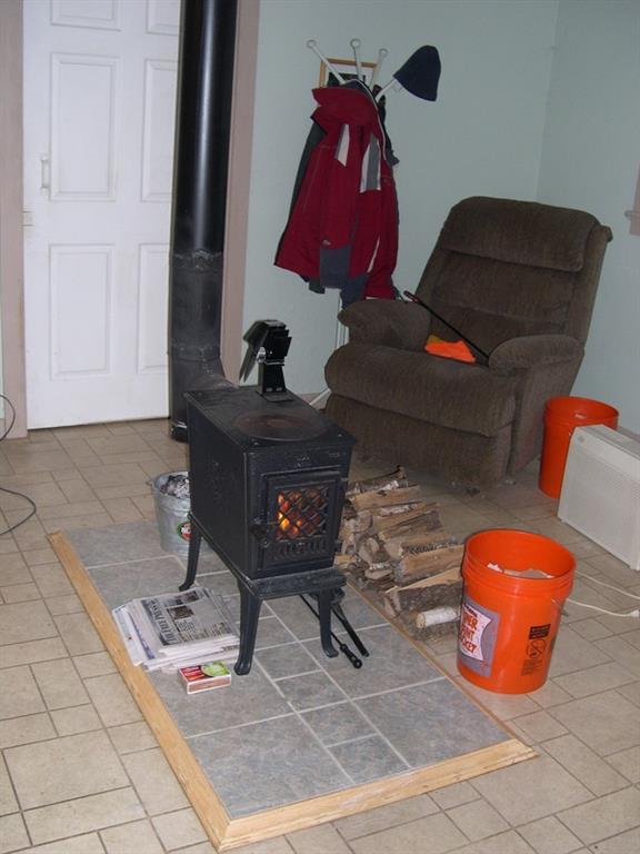 246 Belfast Augusta Road Searsmont, ME 04973 - Photo 4 of 21 Living Room, Jotul wood stove 602