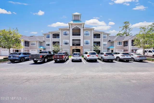 a view of a cars parked in front of a building