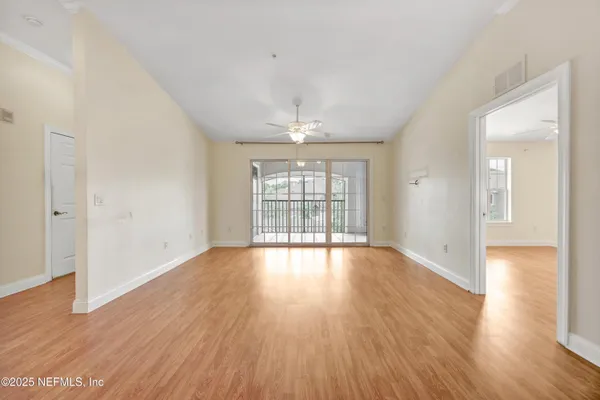 a view of empty room with windows