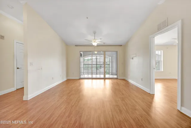 a view of empty room with windows