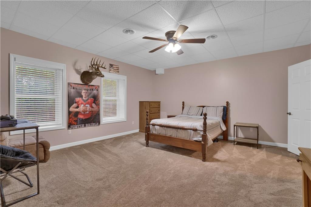560 Bash Road Indiana, PA 15701 - Photo 17 of 25 a bedroom with a bed and a chandelier
