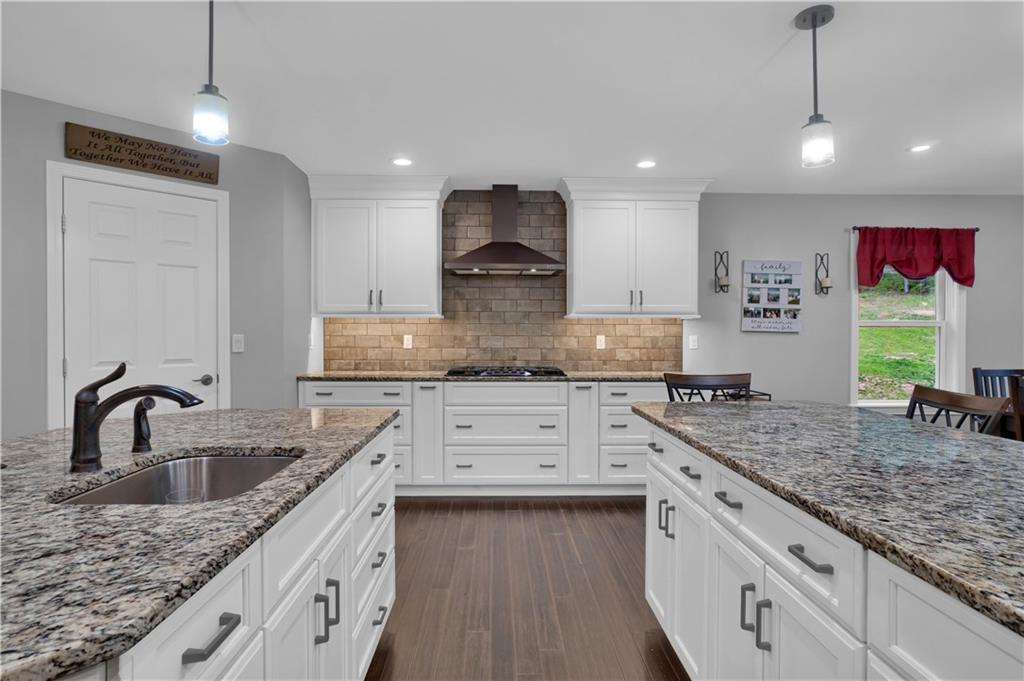560 Bash Road Indiana, PA 15701 - Photo 7 of 25 a kitchen with granite countertop a sink stainless steel appliances and white cabinets