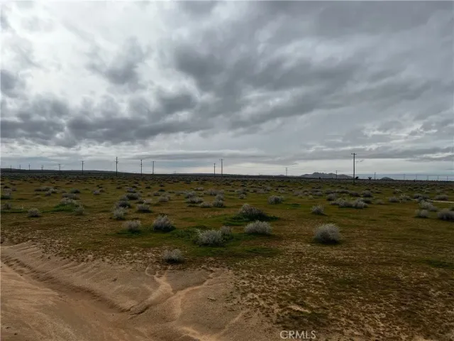 a view of a large body of water and mountain in back