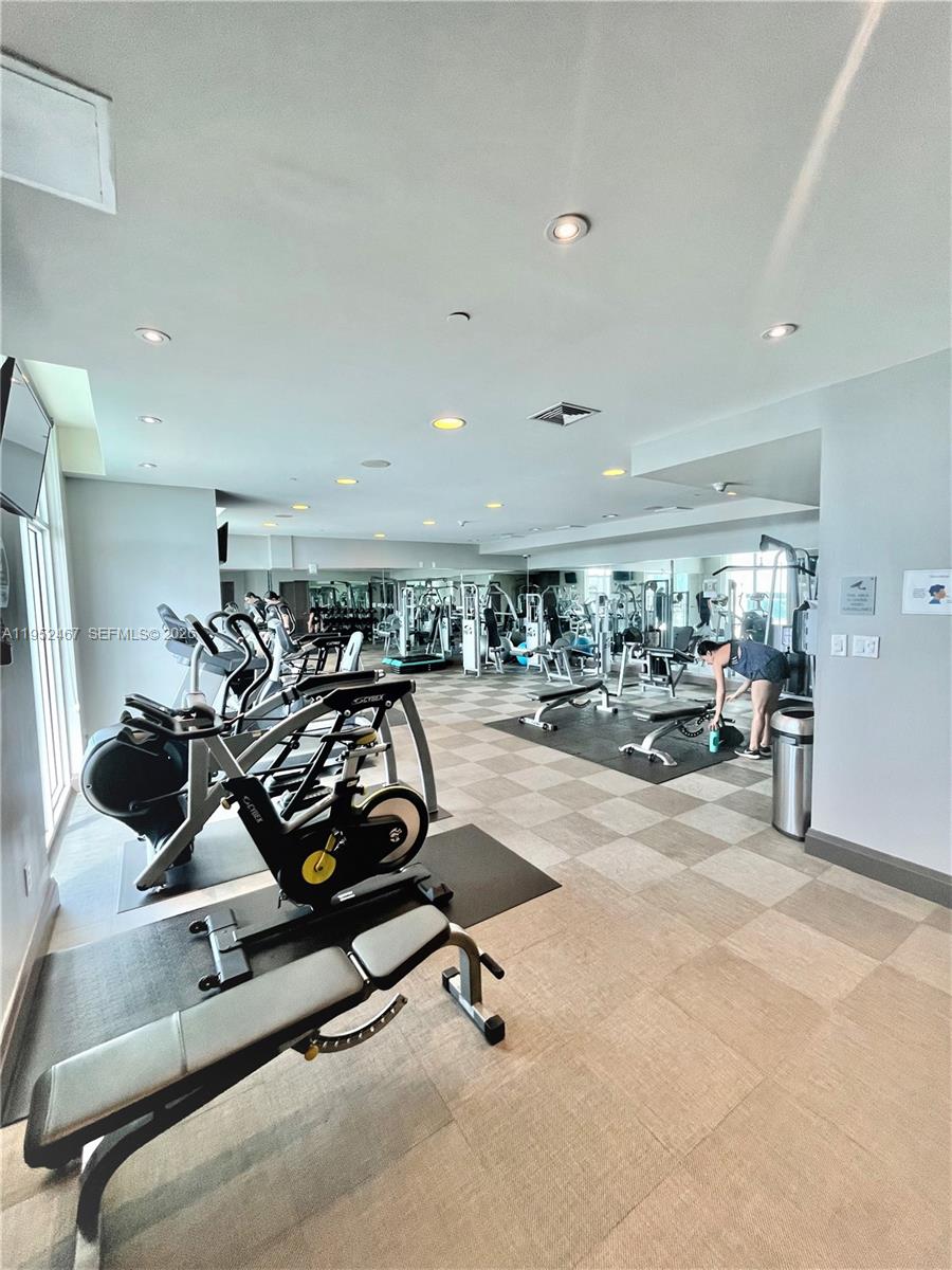 2525 Southwest 3rd Avenue, Unit 1709 Miami, FL 33129 - Photo 12 of 15 a view of a room with gym equipment