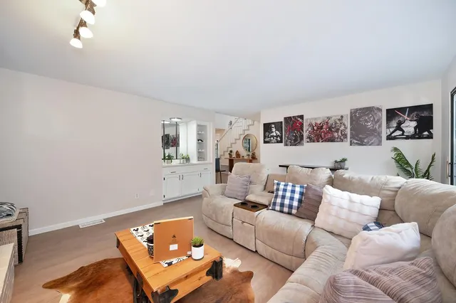 a living room with furniture and a couch