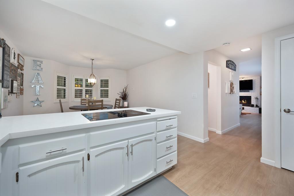 8477 Rick Mary Court Fair Oaks, CA 95628 - Photo 20 of 48 a view of a kitchen with refrigerator and white cabinets