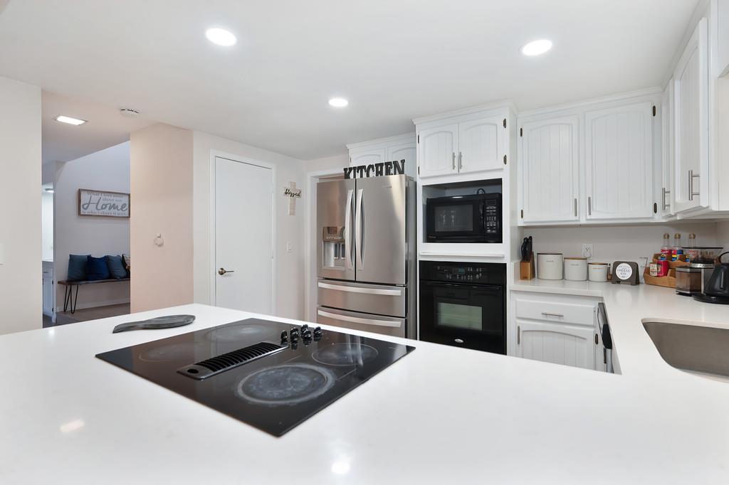 8477 Rick Mary Court Fair Oaks, CA 95628 - Photo 22 of 48 a kitchen with a refrigerator stove and sink