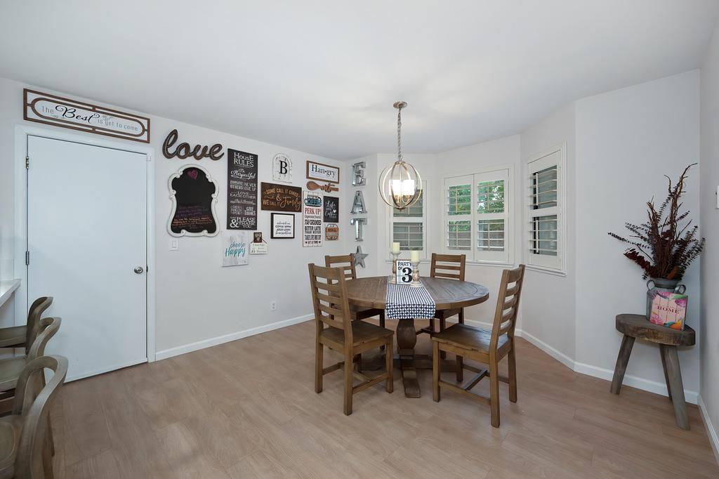 8477 Rick Mary Court Fair Oaks, CA 95628 - Photo 24 of 48 a view of a dining room with furniture and chandelier