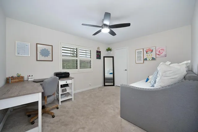 a workspace with furniture and window