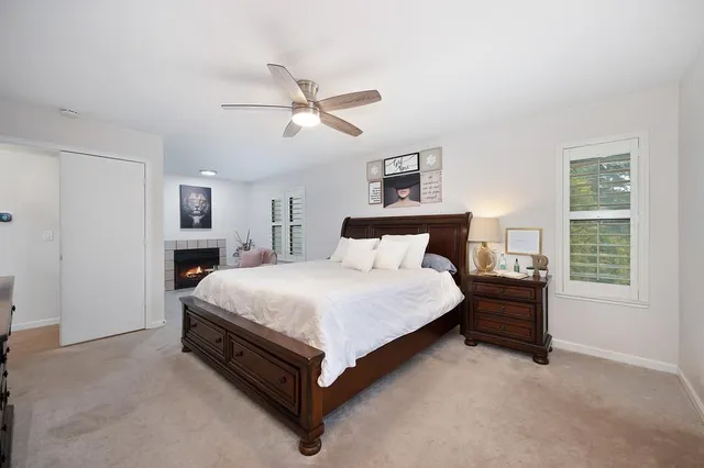 a bedroom with a bed and window