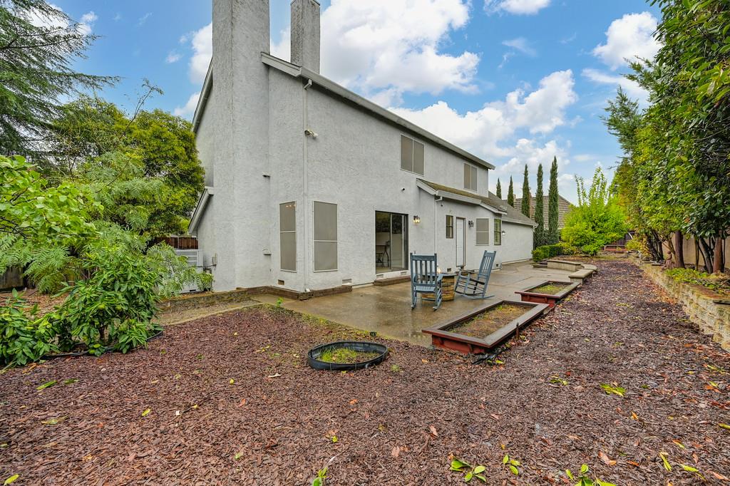 8477 Rick Mary Court Fair Oaks, CA 95628 - Photo 40 of 48 a view of a backyard with plants and a patio
