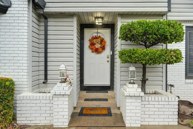 a front view of a house with large windows
