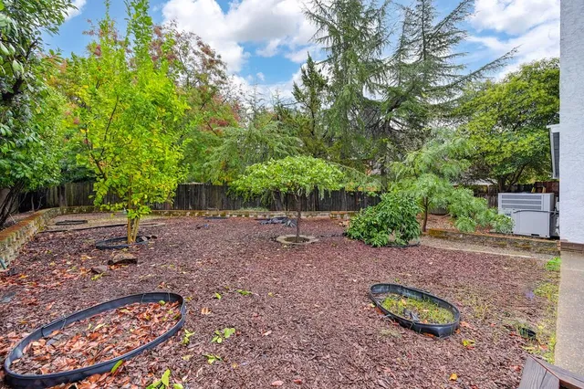 a backyard of a house with lots of green space