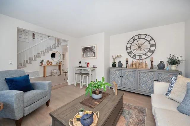 a living room with furniture and a table