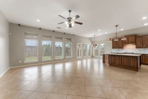 a view of a kitchen with a sink and a fireplace
