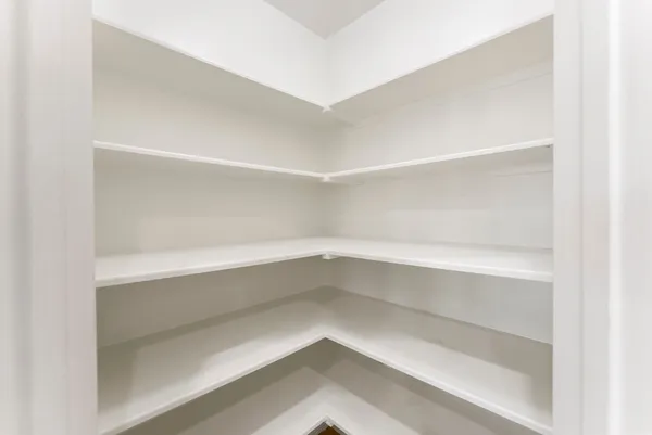 a view of wooden floor and windows in a room