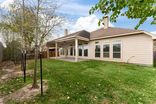 a view of a lake with houses in the background