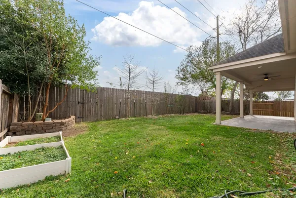 an aerial view of residential house with outdoor space