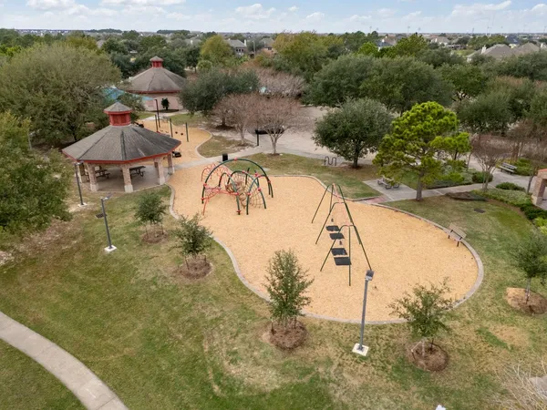a view of a lake with houses in the background