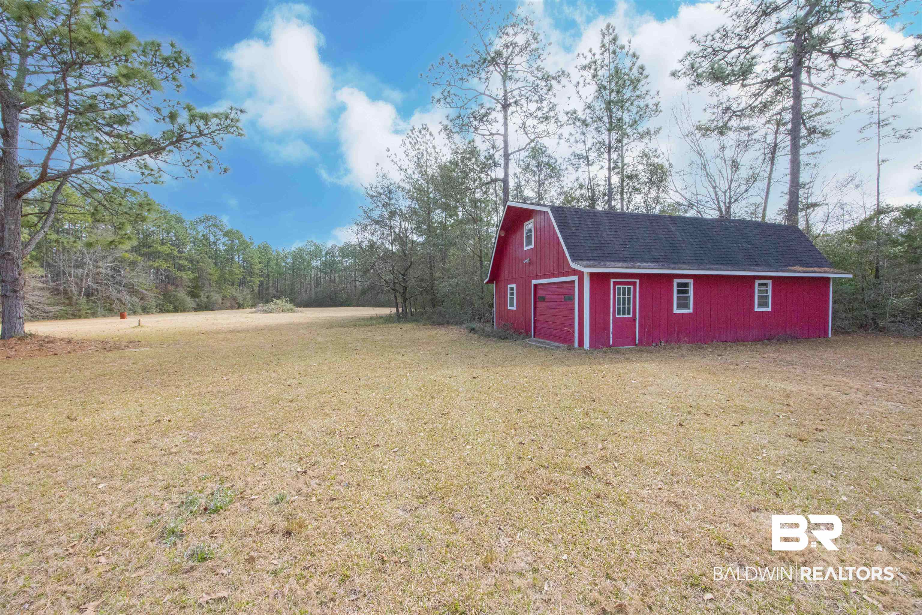 47580 Rabun Road Bay Minette, AL 36507 - Photo 48 of 55 View of yard featuring driveway, an outdoor structure, a barn, and a detached garage