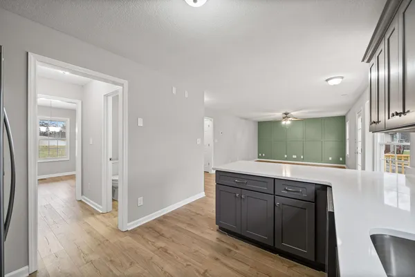a kitchen with a sink and cabinets