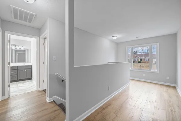wooden floor in an empty room and a window