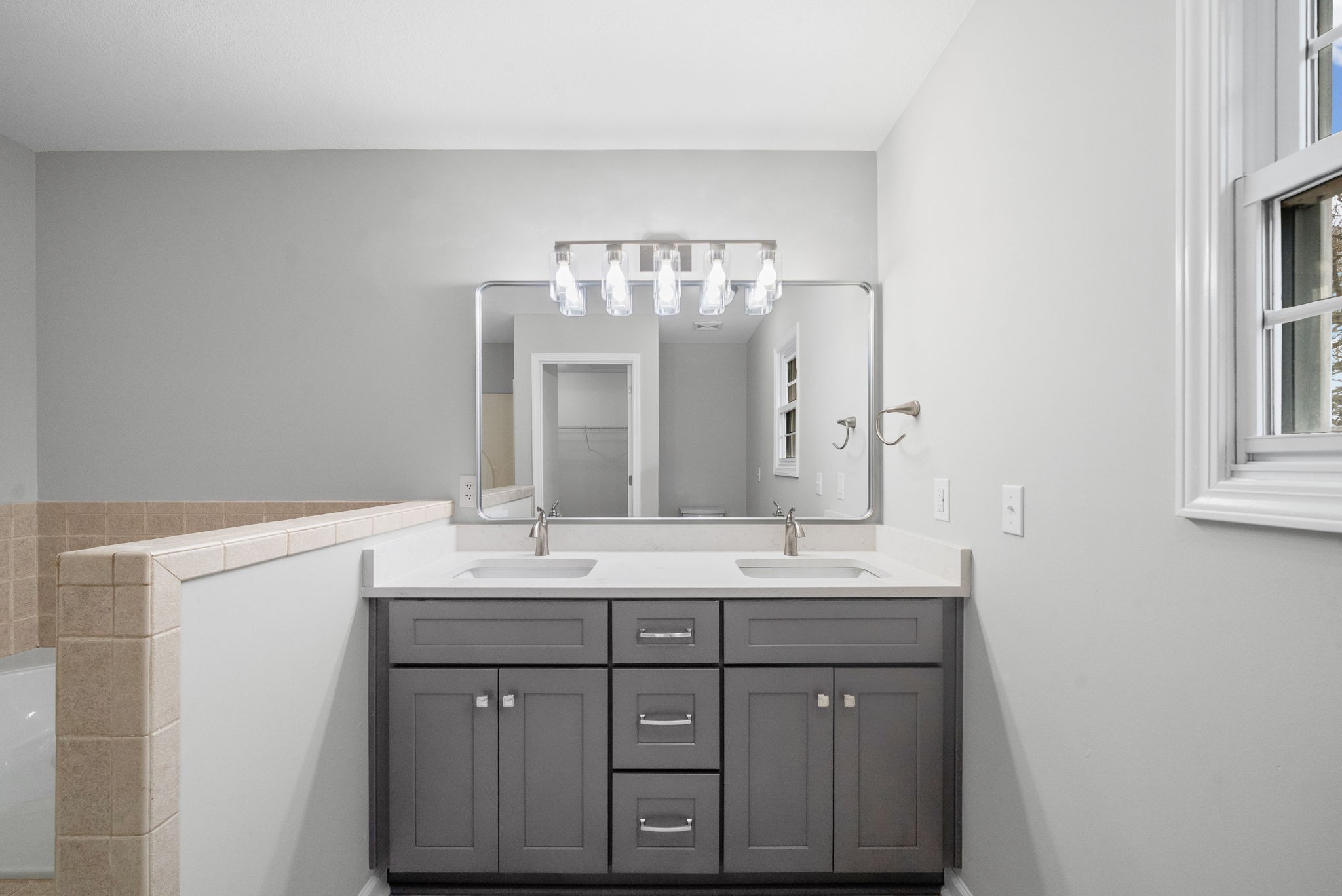 3118 Larson Lane Clarksville, TN 37043 - Photo 23 of 37 a bathroom with a double vanity sink and a mirror