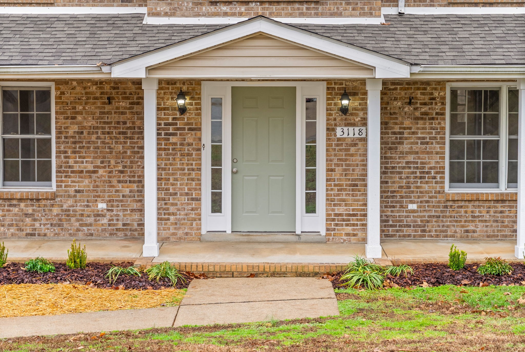 3118 Larson Lane Clarksville, TN 37043 - Photo 4 of 37 a front view of a house with a garden