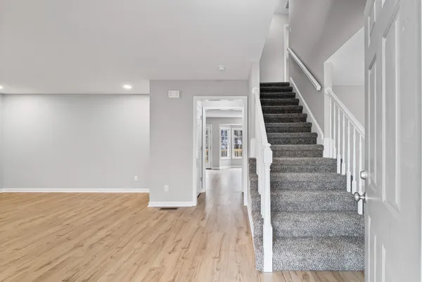 a view of entryway with wooden floor