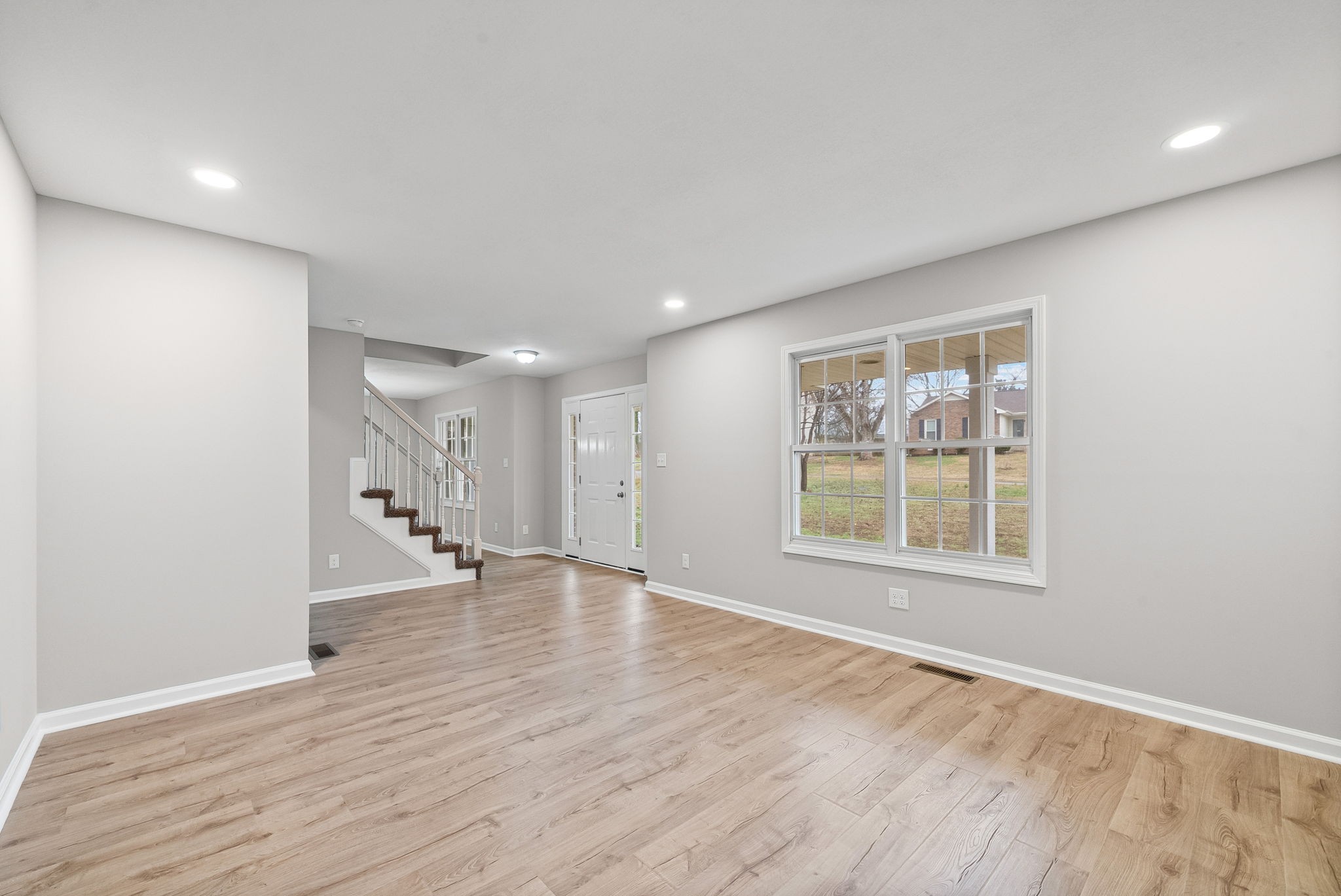 3118 Larson Lane Clarksville, TN 37043 - Photo 8 of 37 a view of an empty room with wooden floor and a window