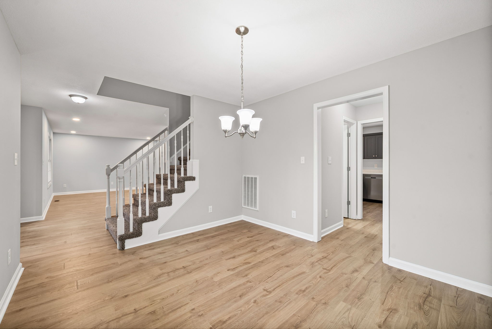 3118 Larson Lane Clarksville, TN 37043 - Photo 10 of 37 a view of a hallway with wooden floor and staircase