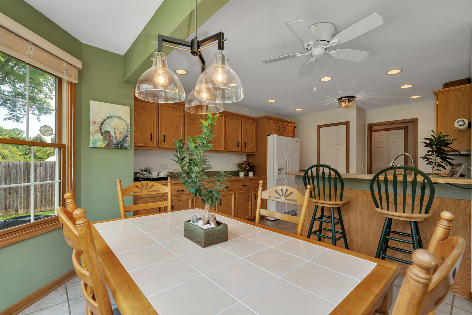 515 Boardman Circle Bolingbrook, IL 60440 - Photo 12 of 31 a view of a dining room with furniture and a chandelier