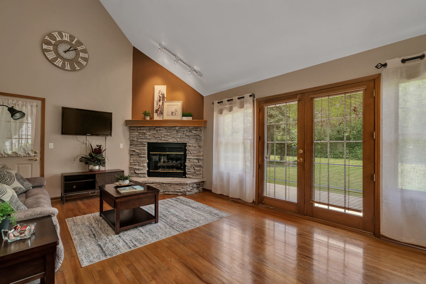 515 Boardman Circle Bolingbrook, IL 60440 - Photo 13 of 31 a living room with furniture large window and a fireplace