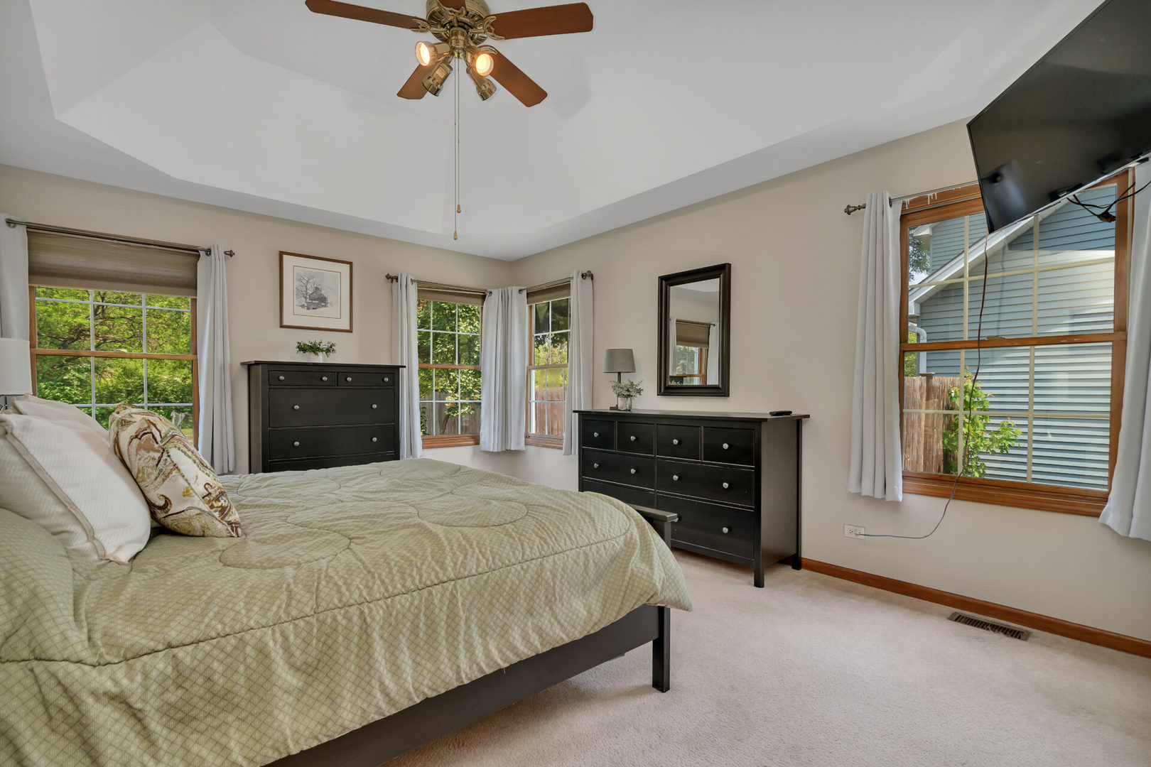 515 Boardman Circle Bolingbrook, IL 60440 - Photo 18 of 31 a bedroom with a bed and dresser with mirror