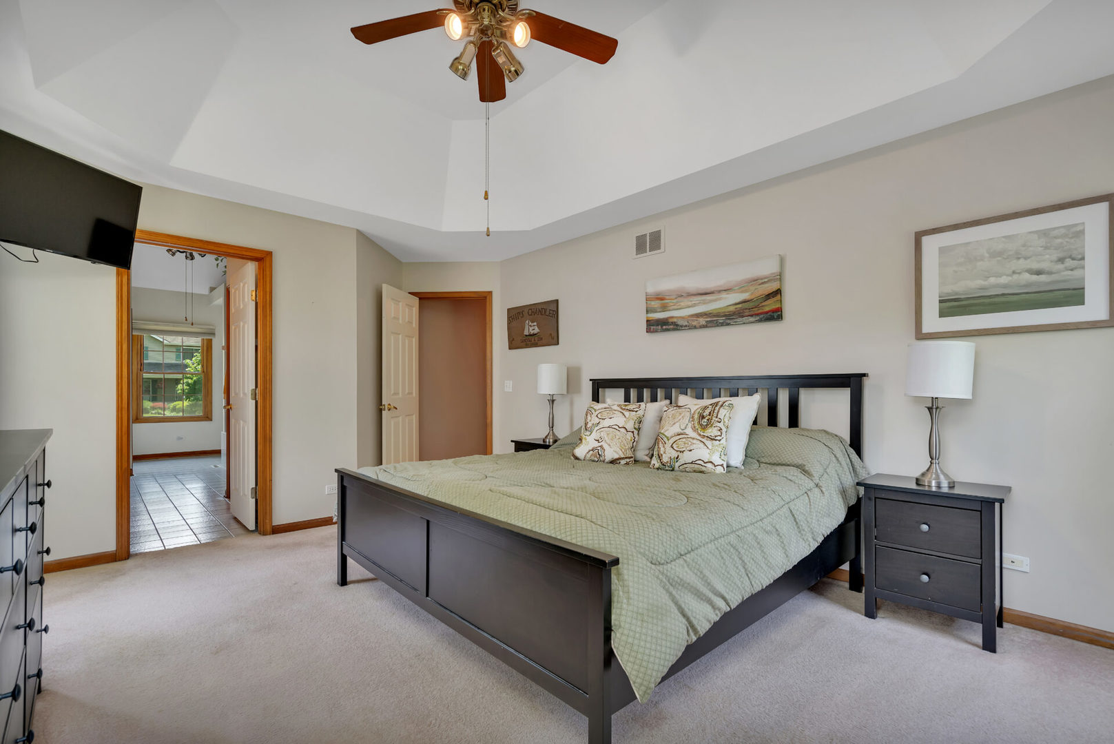 515 Boardman Circle Bolingbrook, IL 60440 - Photo 19 of 31 a bedroom with a large bed and a chandelier