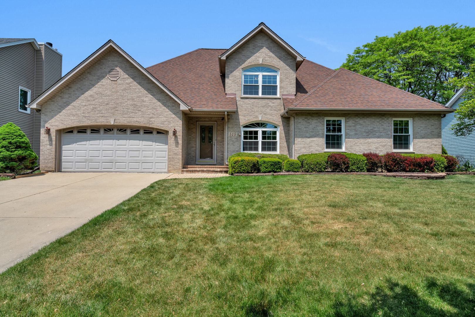 515 Boardman Circle Bolingbrook, IL 60440 - Photo 2 of 31 a front view of a house with garden