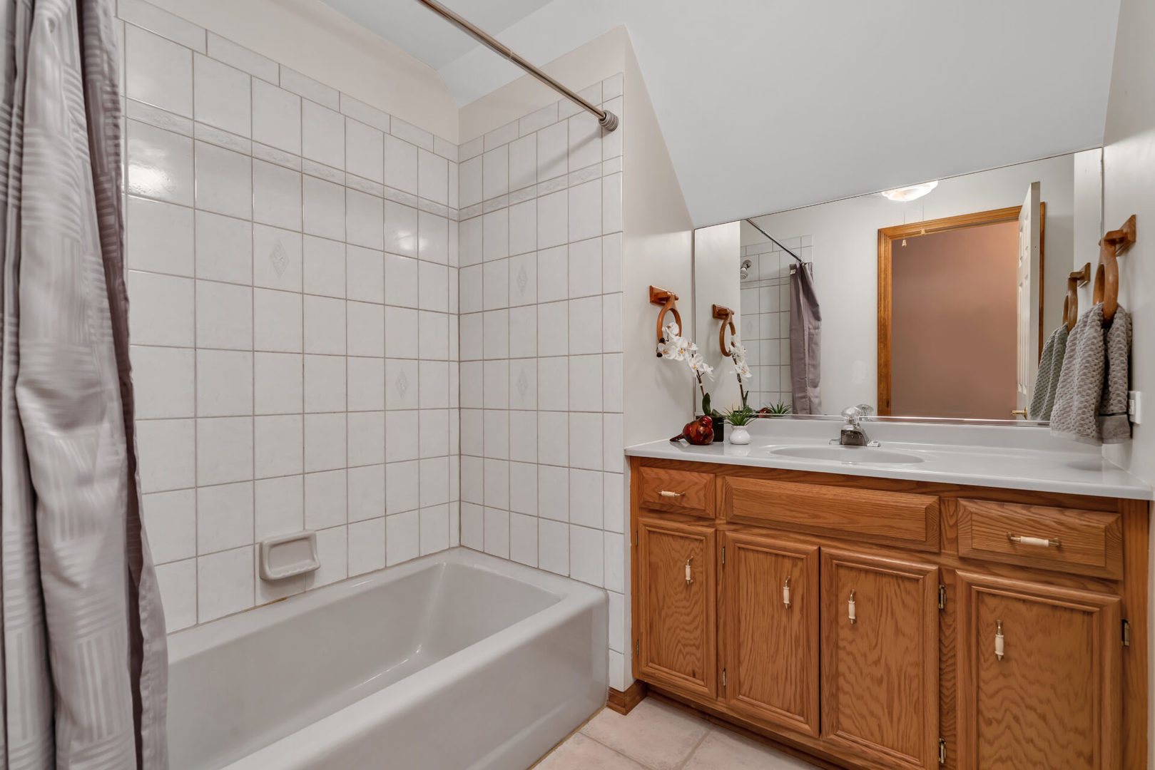 515 Boardman Circle Bolingbrook, IL 60440 - Photo 24 of 31 a bathroom with a granite countertop sink a mirror and a bathtub