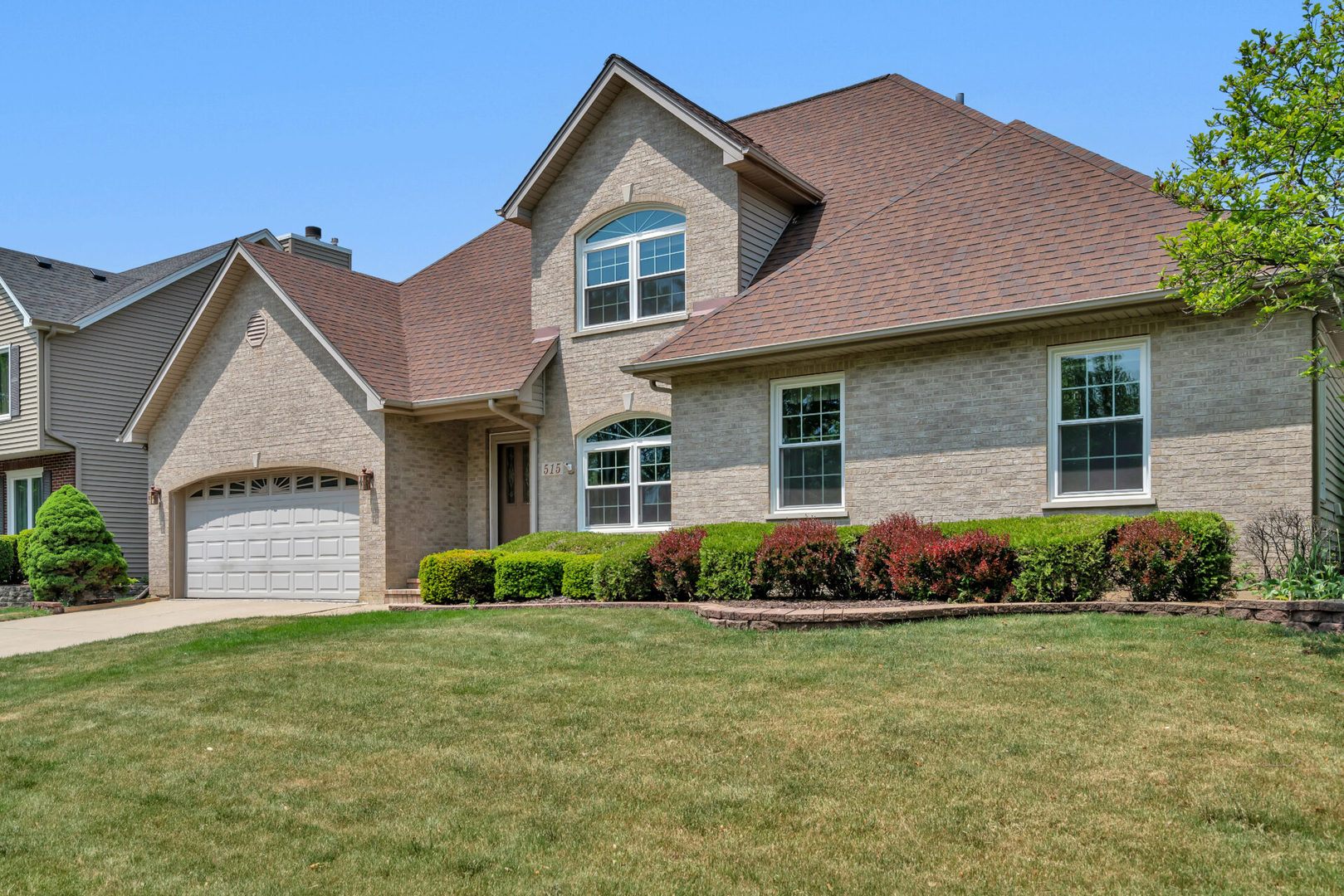 515 Boardman Circle Bolingbrook, IL 60440 - Photo 31 of 31 a front view of a house with a garden