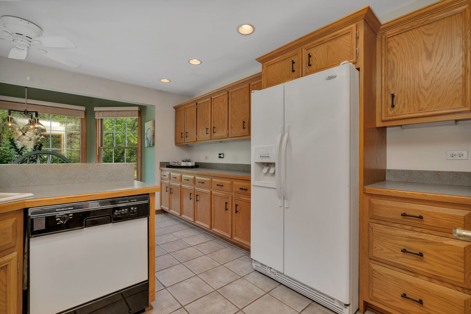 515 Boardman Circle Bolingbrook, IL 60440 - Photo 7 of 31 a kitchen with white cabinets and white appliances