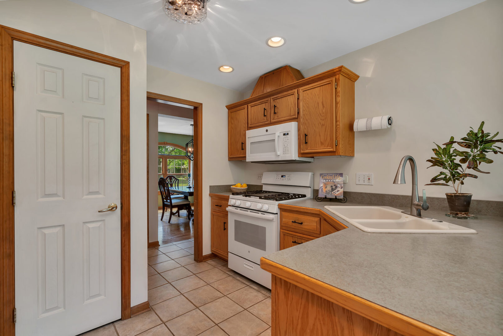 515 Boardman Circle Bolingbrook, IL 60440 - Photo 9 of 31 a kitchen with stainless steel appliances granite countertop a sink and a stove top oven