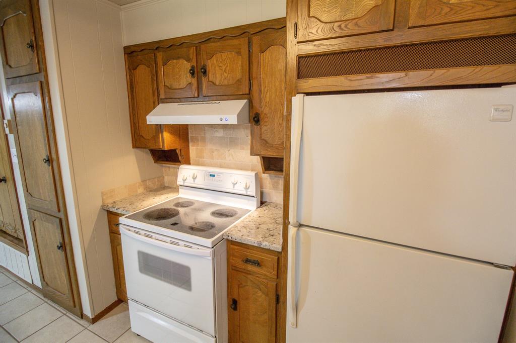 Tbd Crooked Creek Road Bowie, TX 76230 - Photo 11 of 35 a kitchen with a stove a refrigerator and cabinets