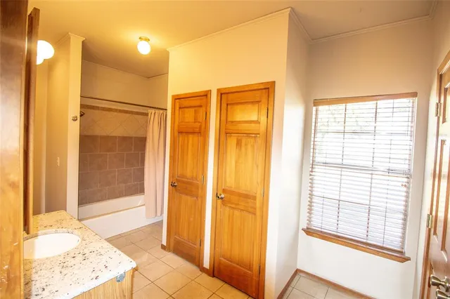 a bathroom with a tub and shower
