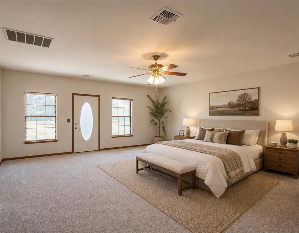 Tbd Crooked Creek Road Bowie, TX 76230 - Photo 15 of 35 a bedroom with a large bed a chandelier and windows