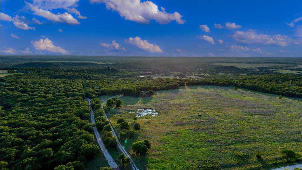 Tbd Crooked Creek Road Bowie, TX 76230 - Photo 2 of 35 a view of a lake in middle of forest