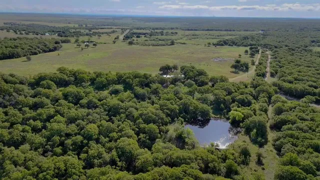 an aerial view of valley and lake