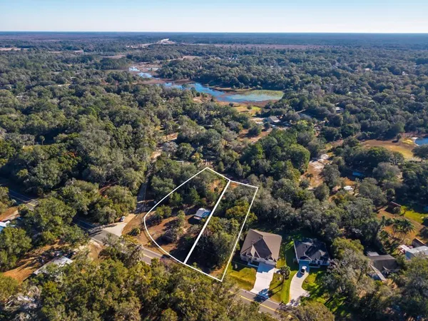 an aerial view of house with yard
