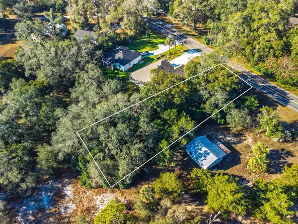an aerial view of house with yard