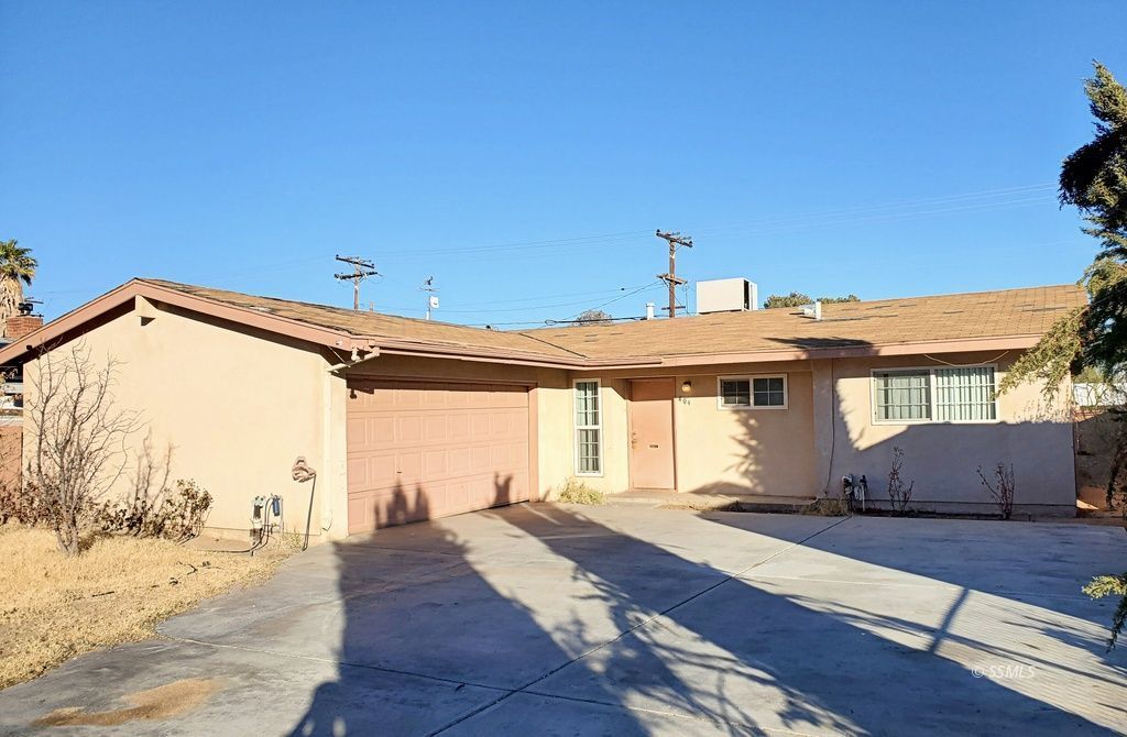 404 Lenore Street Ridgecrest, CA 93555 - Photo 2 of 30 a view of a house with wooden floor and a backyard