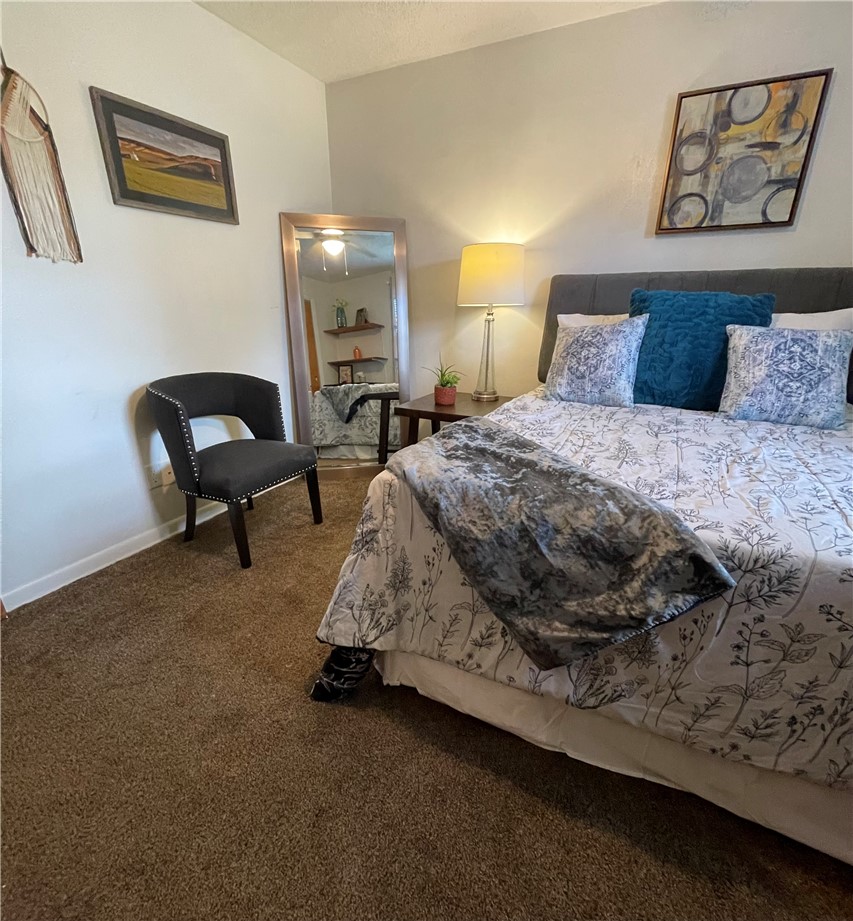 360 Ridge Street Piqua, OH 45356 - Photo 20 of 46 This cozy bedroom features warm carpeting and a comfortable bed, perfect for peaceful nights.