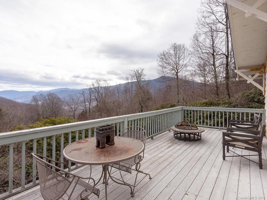 1267 Walker Road Waynesville, NC 28786 - Photo 8 of 23 a view of balcony with furniture and wooden deck
